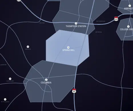 Map highlighting Spring Hill, Tennessee, showing surrounding areas including Thompson Station and Columbia, with major roads indicated.