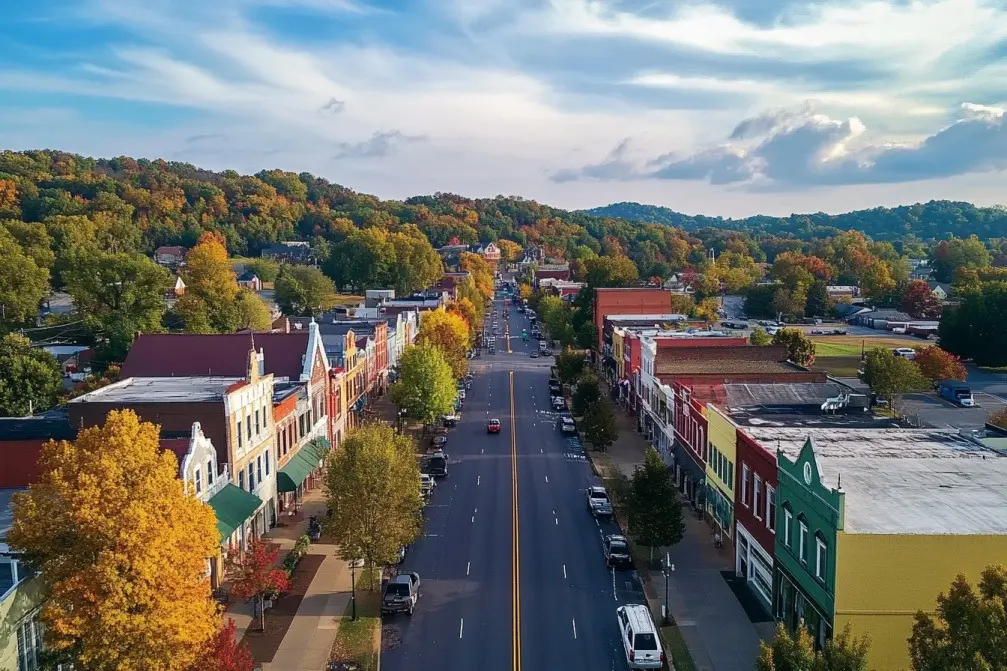 Aerial view of Goodlettsville, Tennessee, showcasing charming downtown storefronts, vibrant autumn foliage, and a peaceful suburban atmosphere.