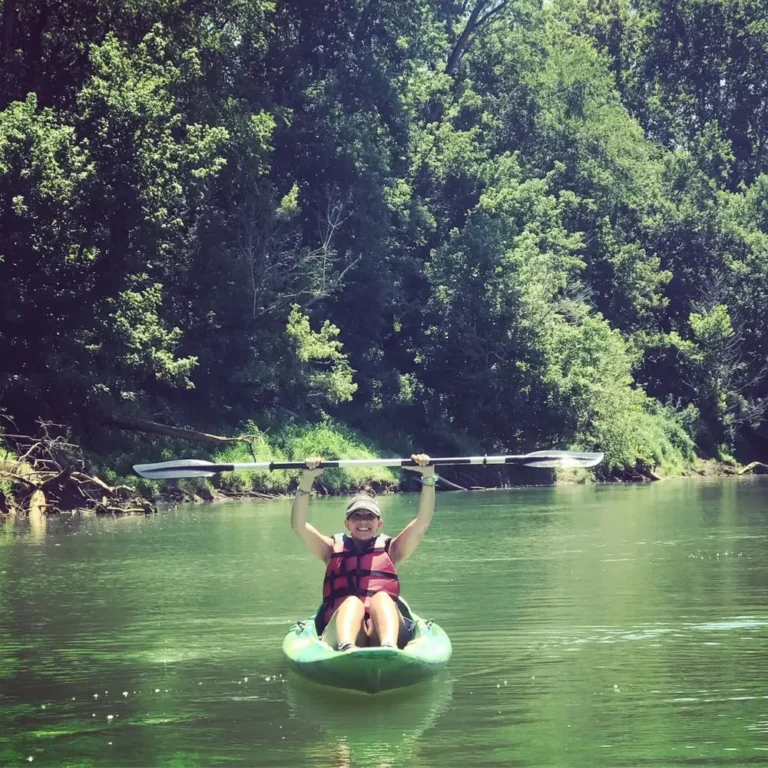 a person in a kayak on a river